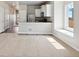 Open-concept living room featuring a breakfast bar, lots of natural light, and neutral decor at 709 Twining Ave, Brighton, CO 80601