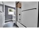 Modern bathroom with sleek fixtures, updated shower, and black and white tile at 8710 Alta Vista Dr, Arvada, CO 80004