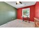 Inviting bedroom with an accent wall and a window, perfect for a hobby room at 8710 Alta Vista Dr, Arvada, CO 80004