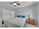 Cozy bedroom features soft carpet, a ceiling fan, and neutral-toned walls at 8710 Alta Vista Dr, Arvada, CO 80004