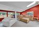 Cozy living room with natural light and comfortable seating area and backyard views at 8710 Alta Vista Dr, Arvada, CO 80004