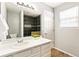 Bright bathroom featuring a modern vanity, stylish lighting, and walk-in shower at 5264 E 129Th Pl, Thornton, CO 80241