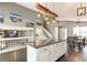 Open-concept kitchen featuring island with seating, leading into a dining area and spacious living area at 5264 E 129Th Pl, Thornton, CO 80241