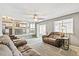 Inviting living room featuring neutral decor, sliding glass doors, and comfortable seating at 5264 E 129Th Pl, Thornton, CO 80241