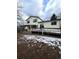 Back exterior view features a covered patio, sliding glass door to the deck and a fenced yard at 14989 E Pacific Pl, Aurora, CO 80014