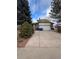 Charming two-story home features brick accents, an attached two-car garage, and a well-maintained front yard at 14989 E Pacific Pl, Aurora, CO 80014