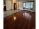 Inviting living room with a bay window, tiled entry and shiny hard wood flooring at 14989 E Pacific Pl, Aurora, CO 80014