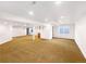 Expansive finished basement with recessed lighting, carpeted floors, and neutral color palette at 18951 E 43Rd Ave, Denver, CO 80249