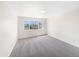 Sunlit bedroom with a large window offering neighborhood views at 18951 E 43Rd Ave, Denver, CO 80249
