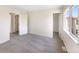 Bright bedroom featuring two doorways, one leading to a closet space, and a window at 18951 E 43Rd Ave, Denver, CO 80249