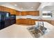 Well-lit kitchen with stainless steel appliances and ample cabinet space at 18951 E 43Rd Ave, Denver, CO 80249