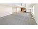 Open-concept living area with a fireplace and seamless flooring transitions at 18951 E 43Rd Ave, Denver, CO 80249