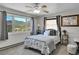 Cozy bedroom featuring a comfortable bed, soft gray accents, and a serene mountain view from the window at 617 Hummingbird Trl, Idaho Springs, CO 80452