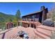 Expansive deck with cozy fire pit and views offers an inviting outdoor living space, perfect for relaxation and entertaining at 617 Hummingbird Trl, Idaho Springs, CO 80452