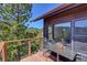 Private deck with outdoor seating provides a tranquil spot to enjoy the beautiful mountain views and fresh air at 617 Hummingbird Trl, Idaho Springs, CO 80452