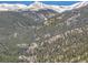 Breathtaking mountain view with snow-capped peaks amidst lush greenery, creating a stunning and picturesque landscape at 617 Hummingbird Trl, Idaho Springs, CO 80452