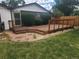 Cozy backyard deck with a wooden railing and lattice accent, great for outdoor living at 6961 E Arkansas Ave, Denver, CO 80224