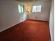Cozy bedroom with natural light from two windows at 6961 E Arkansas Ave, Denver, CO 80224
