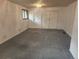 Bedroom featuring neutral carpet and a closet with sliding doors at 6961 E Arkansas Ave, Denver, CO 80224