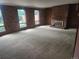 Spacious living room with brick fireplace and large windows at 6961 E Arkansas Ave, Denver, CO 80224