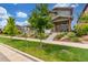 A delightful home with a cozy front porch, set amidst a well-maintained lawn and mature trees at 21451 E 60Th Ave, Aurora, CO 80019