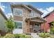 Attractive home with a modern exterior, showcasing a covered front porch perfect for relaxing outdoors at 21451 E 60Th Ave, Aurora, CO 80019