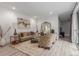 Cozy living room with plush rug, stylish furniture, ample natural light, and an open floor plan at 21451 E 60Th Ave, Aurora, CO 80019
