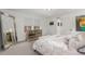 This bright main bedroom has carpeting and a large mirror with windows that let in natural light at 21451 E 60Th Ave, Aurora, CO 80019