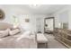 Serene bedroom featuring a plush bed, mirrored dresser, and minimalist decor at 21451 E 60Th Ave, Aurora, CO 80019