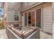 Relaxing outdoor patio area with comfortable seating and string lights at 21451 E 60Th Ave, Aurora, CO 80019