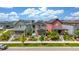 Street view showing various home styles with landscaped front yards under a bright sky at 21451 E 60Th Ave, Aurora, CO 80019