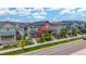 Street view of houses with different exteriors and nicely landscaped front yards at 21451 E 60Th Ave, Aurora, CO 80019