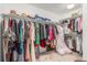 This walk-in closet features ample hanging space with rods and shelves for maximum storage at 21451 E 60Th Ave, Aurora, CO 80019