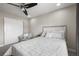 Cozy bedroom with ceiling fan, seating area, and closet at 9021 Swan River St, Littleton, CO 80125