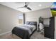 Serene bedroom with a window view, desk, and comfortable furnishings at 9021 Swan River St, Littleton, CO 80125