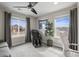 Bonus room with multiple windows and a massage chair at 9021 Swan River St, Littleton, CO 80125