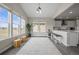Bright dining area with large windows, vaulted ceilings, and easy access to kitchen at 9021 Swan River St, Littleton, CO 80125