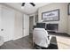 Functional home office with two monitors, a comfortable chair, and neutral wall color at 9021 Swan River St, Littleton, CO 80125