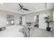 Main bedroom with stylish barn door to bathroom and ample space for furnishings and decor at 9021 Swan River St, Littleton, CO 80125