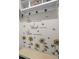Mud room with storage, coat hooks, and motivational decor at 9021 Swan River St, Littleton, CO 80125