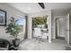 Bright home office featuring a built-in desk and monitors, a green wall, and neutral decor, creating a work from home oasis at 9021 Swan River St, Littleton, CO 80125