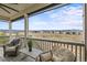Cozy outdoor patio featuring comfortable seating and scenic views of the surrounding landscape at 9021 Swan River St, Littleton, CO 80125