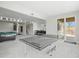 Spacious recreation room with a pool table, ping pong table, and access to the outdoors at 9021 Swan River St, Littleton, CO 80125