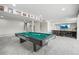 Spacious recreation room with a pool table, a bar, and a TV at 9021 Swan River St, Littleton, CO 80125
