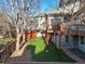 The backyard features an elevated deck, a grassy area, a shed, and is surrounded by a wood fence at 853 Huntington Dr, Highlands Ranch, CO 80126