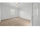 Neutral bedroom with large window and ceiling fan at 853 Huntington Dr, Highlands Ranch, CO 80126