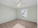 Mint bedroom with large window and ceiling fan at 853 Huntington Dr, Highlands Ranch, CO 80126