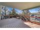 Large deck with an outdoor view, perfect for entertaining and relaxation amidst the serene trees and landscapes at 853 Huntington Dr, Highlands Ranch, CO 80126
