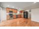 This kitchen features stainless steel appliances and wood cabinets at 853 Huntington Dr, Highlands Ranch, CO 80126