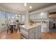 Charming eat-in kitchen featuring a kitchen island, wood floors, ample counter space, and a bay window at 853 Huntington Dr, Highlands Ranch, CO 80126